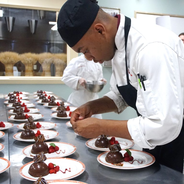 Walnut Hill College pastry student plating chocolate desserts